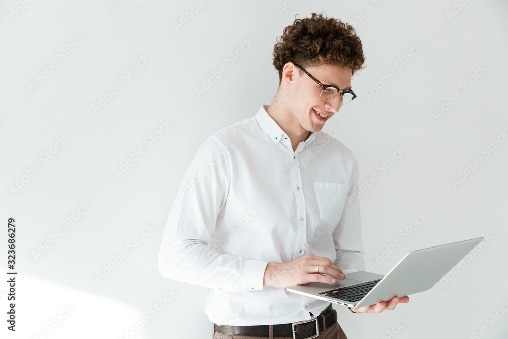 Poster Handsome confident young curly haired businessman