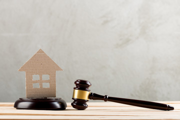Real estate sale auction concept - gavel and house model