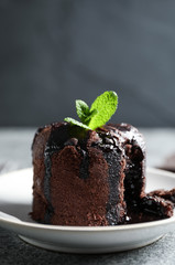 Delicious warm chocolate lava cake on grey table
