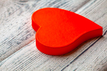 Read heart on grunge wood table