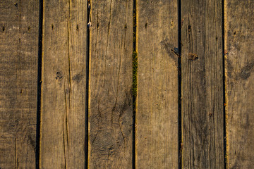 Wooden surface floor as texture grungy scratchy wood close up as retro vintage background toned in warm colors