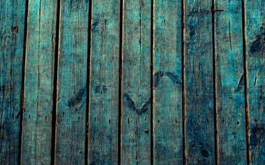 Wooden surface floor as texture grungy scratchy wood close up as retro vintage background in cold blue colors