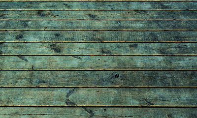 Wooden surface floor as texture grungy scratchy wood close up as retro vintage background toned in blue cold colors