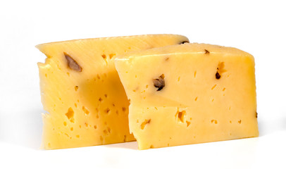 pieces of cheese with nuts on a white background