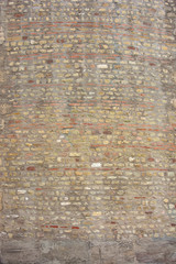 Yellow narrow vintage stone wall texture background