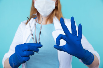 Dentist tools. Teethcare, dental health concept. Blue background top view copy space