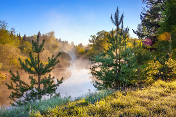 spring landscape with fog and river at sunrise