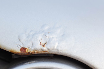 Corrosion and rust on the hood of a car. The concept of anti-corrosion treatment of the car body,...