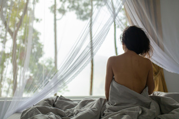 Tender young girl wakes up in the morning