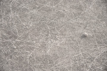 traces on the ice from skates on the rink