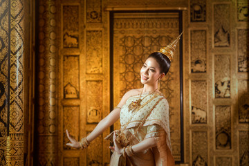 Obraz premium Beautiful woman in traditional dress costume,Asian woman wearing typical Thai dress identity culture of Thailand