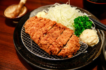 Tonkatsu set Japanese food, deep fried breaded pork cutlet with potato salad and sliced cabbage