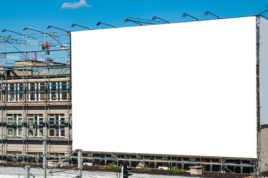 Blank white billboard for advertisement on the wall of industrial building