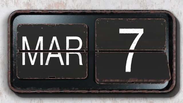 Old Retro style Flip calendar flipping through the month of March