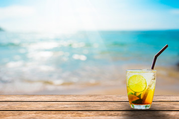 Lemon tea is set on a wooden terrace in the summer, giving a relaxing feeling during the summer holidays.