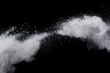 White powder explosion on black background. 