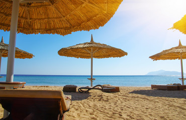 Tropical beach with umbrellas