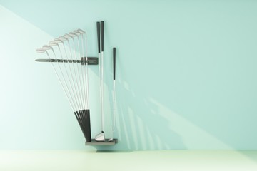 set of golf clubs lit by a ray of light