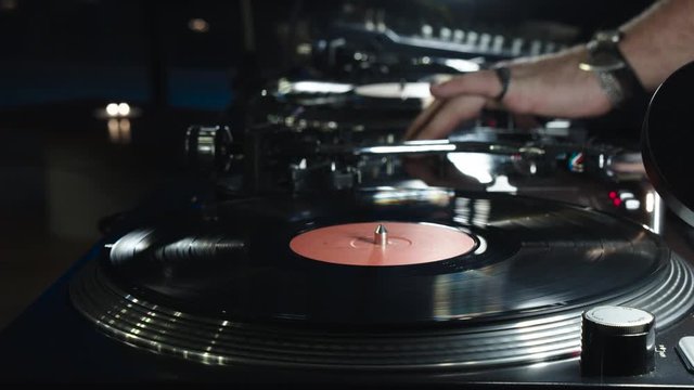 Outdoor music party. Dj playing on vinyl.