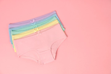 multi-colored cotton panties for a girl on a pink background