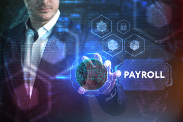 Business, Technology, Internet and network concept. Young businessman working on a virtual screen of the future and sees the inscription: Payroll