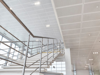 Stairway with chrome guard rails at car showroom