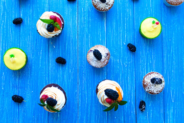 Freshly baked sweet muffins on a blue background. Sweet pastries, recipes, cooking