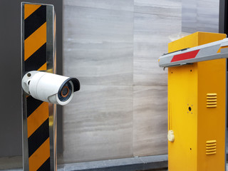 Selective focus on a security camera in front of the car entrance gate. Safety process to record...