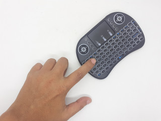 Modern Artistic Black TV Remote with QWERTY Keypad and Game Tools in White Isolated Background