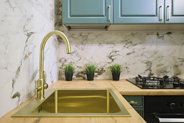 Brass kitchen sink in gold color