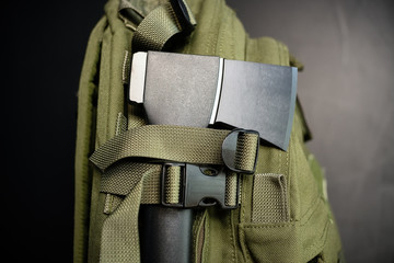 Fiberglass axe on a green backpack