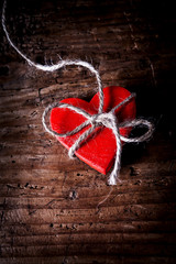 red wooden heart with tie
