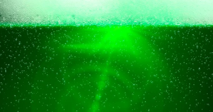 St. Patrick's Day Green Beer background with lens flare. For festive pub party event. 3d render, loop 4k
