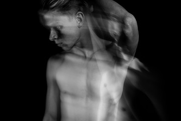 attractive handsome naked man portrait. Black and white. Long exposure. doubt and suffering. romantic relationship. jealousy or cheating. Emotional double personality portrait. 