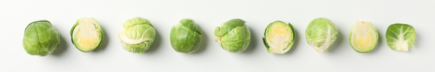 Flat lay with brussels sprout on white background, top view