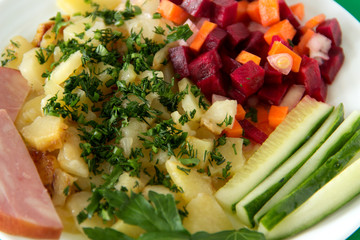 Healthy vitamin lunch. Vegetable salad with stewed potatoes. Close-up