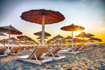 Sun umbrellas and deckchairs on the Copacabana beach, part of Great Beach (Velika Plaza) in Ulcinj