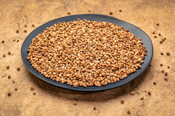 buckwheat kasha on a black plate