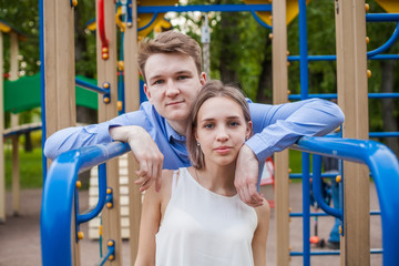 Fototapeta premium Pretty girl and boy together. Young couple outdoor portrait