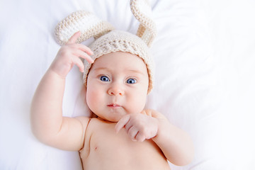 baby in hat with rabbit ears