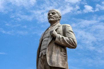 Fototapeta na wymiar Russia, Krasnodar: Wladimir Iljitsch Lenin Monument in the city center of the Russian town isolated against blue sky background - concept travel fame famous memorial remembrance politics icon leader