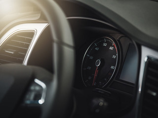 The sign and symbol on car dashboard. Car speedometer closeup. Car interior.