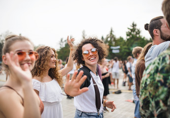 Group of young friends at summer festival.