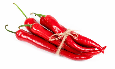 many red peppers on a white background