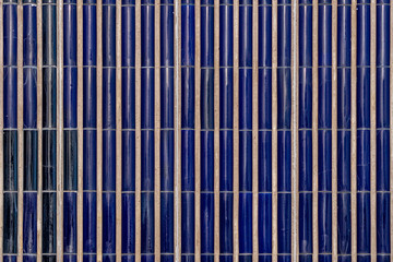 Cobalt blue mosaic wall in sunlight