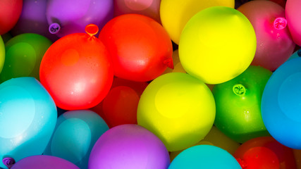 Many bright and colorful water balloons