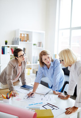 Group of successful businesswomen working together on design project in office, copy space