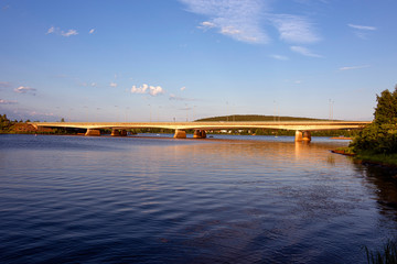 Republic of Finland, Rovaniemi: Modern bridge at the confluence of Kemijoki and Ounasjoki river at...