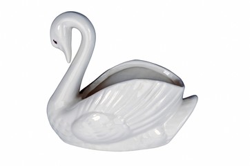 old antique swan silhouette made of white glowing porcelain closeup on full frame figure sitting on white background