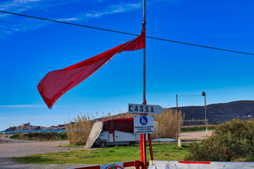 Fototapeta na wymiar warning sign of a red flag on beach